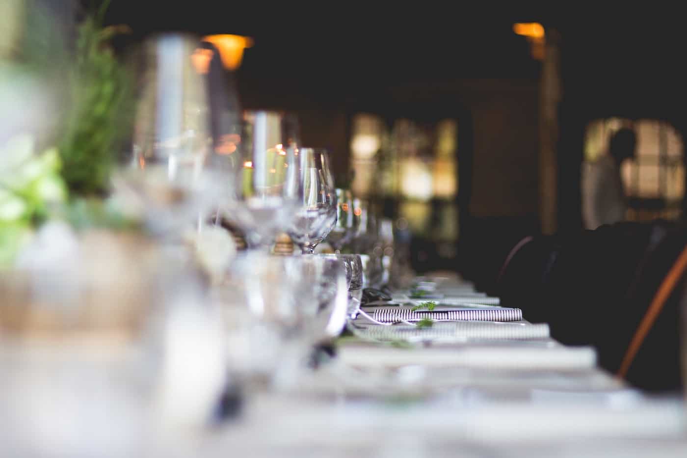 glasses of wine in a row on a table